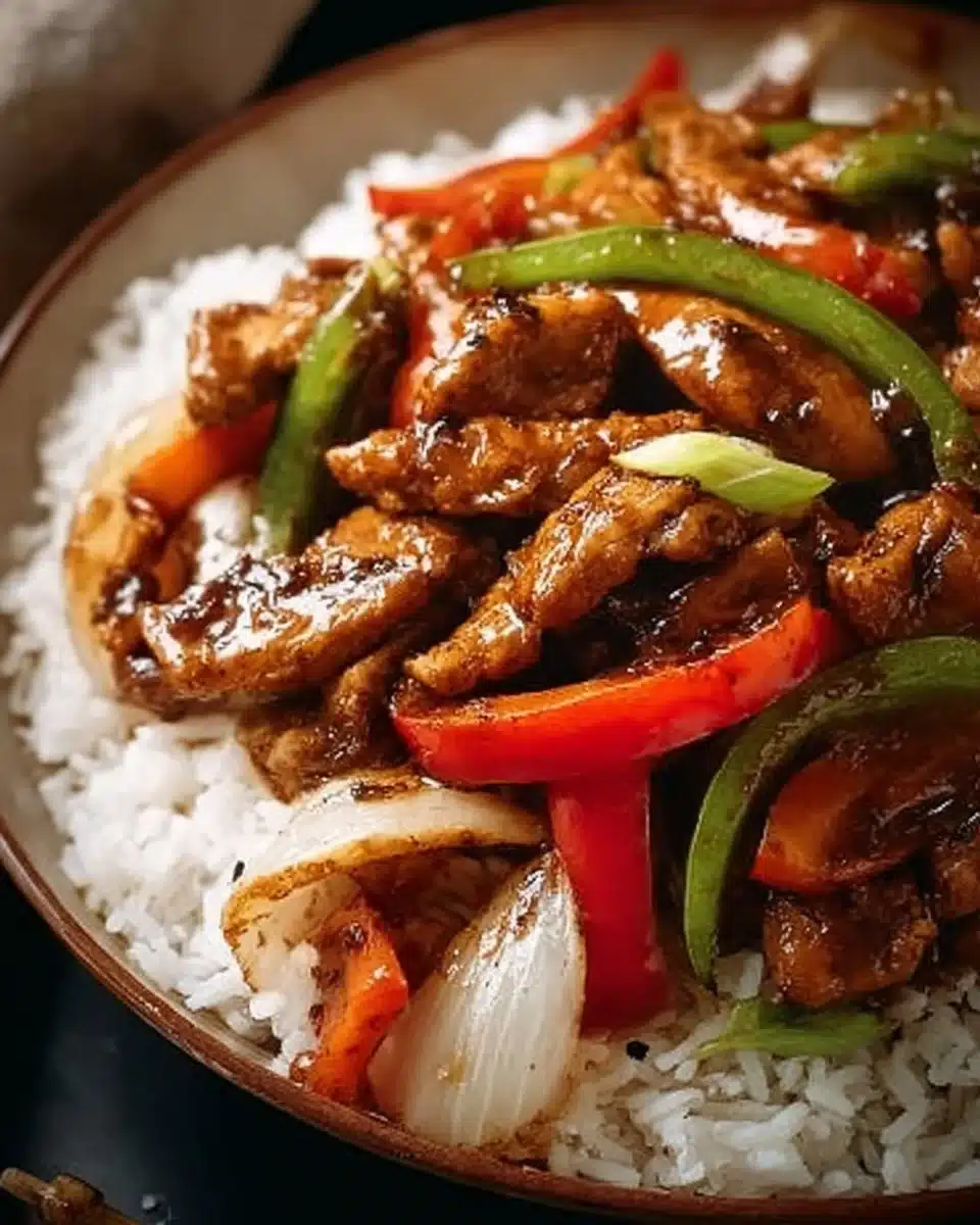 Delicious black pepper chicken served with rice and vegetables